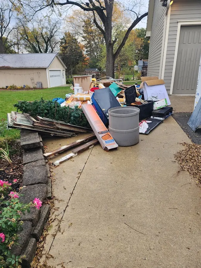 Dumpster being loaded with debris for Commercial Dumpster Rental in Jackson